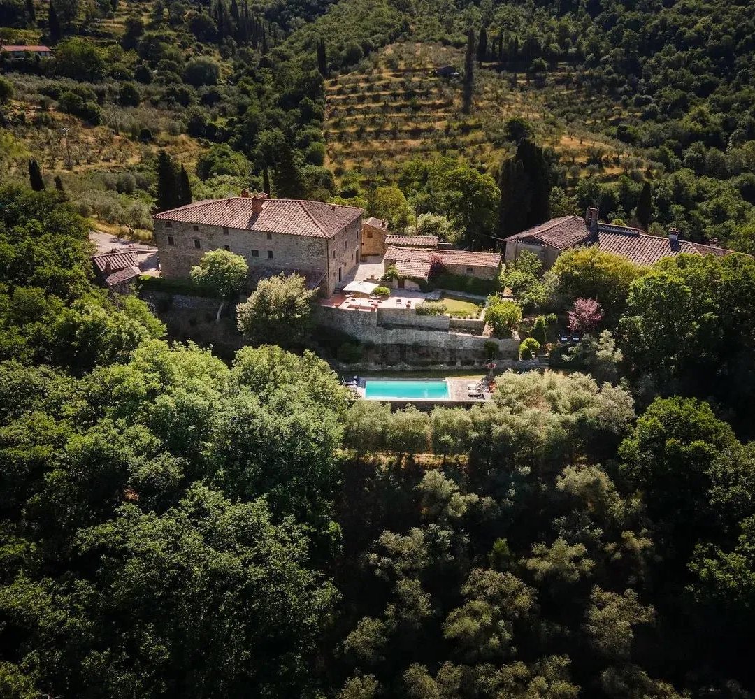 Luxury Tuscan estate with pool and cypress trees, ideal for international buyers relocating to Italy